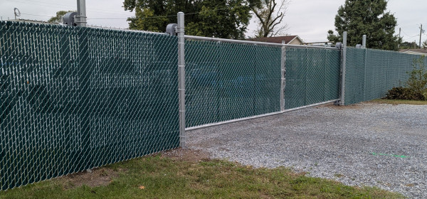 Cantilever-gate-with-green-slats-