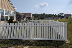 White vinyl picket fence