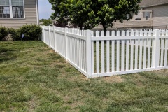 White vinyl picket fence