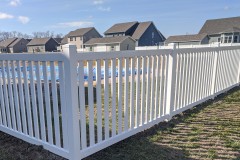 White vinyl picket fence